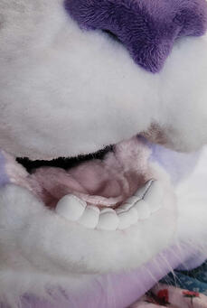 plush, thread-sculpted teeth